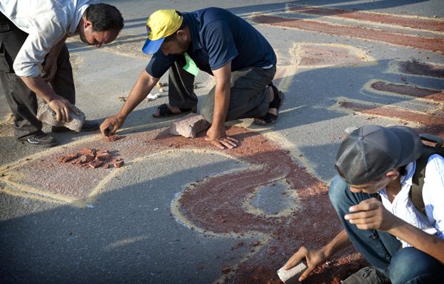 Protesters drawing in the street