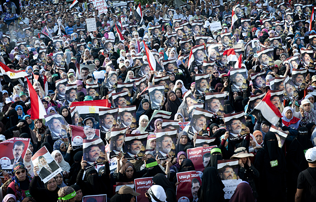 A crowd listens to a speech