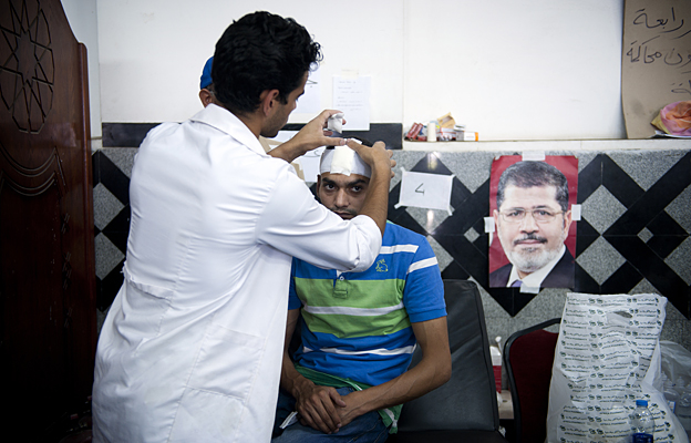 A man having his head bandaged